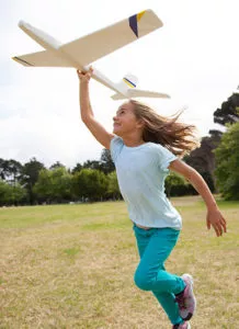 Pediatric Scoliosis child playing with Airplane