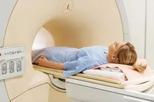 Female patient in CT scanner