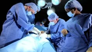 Surgeons installing the intervertebral fusion cage